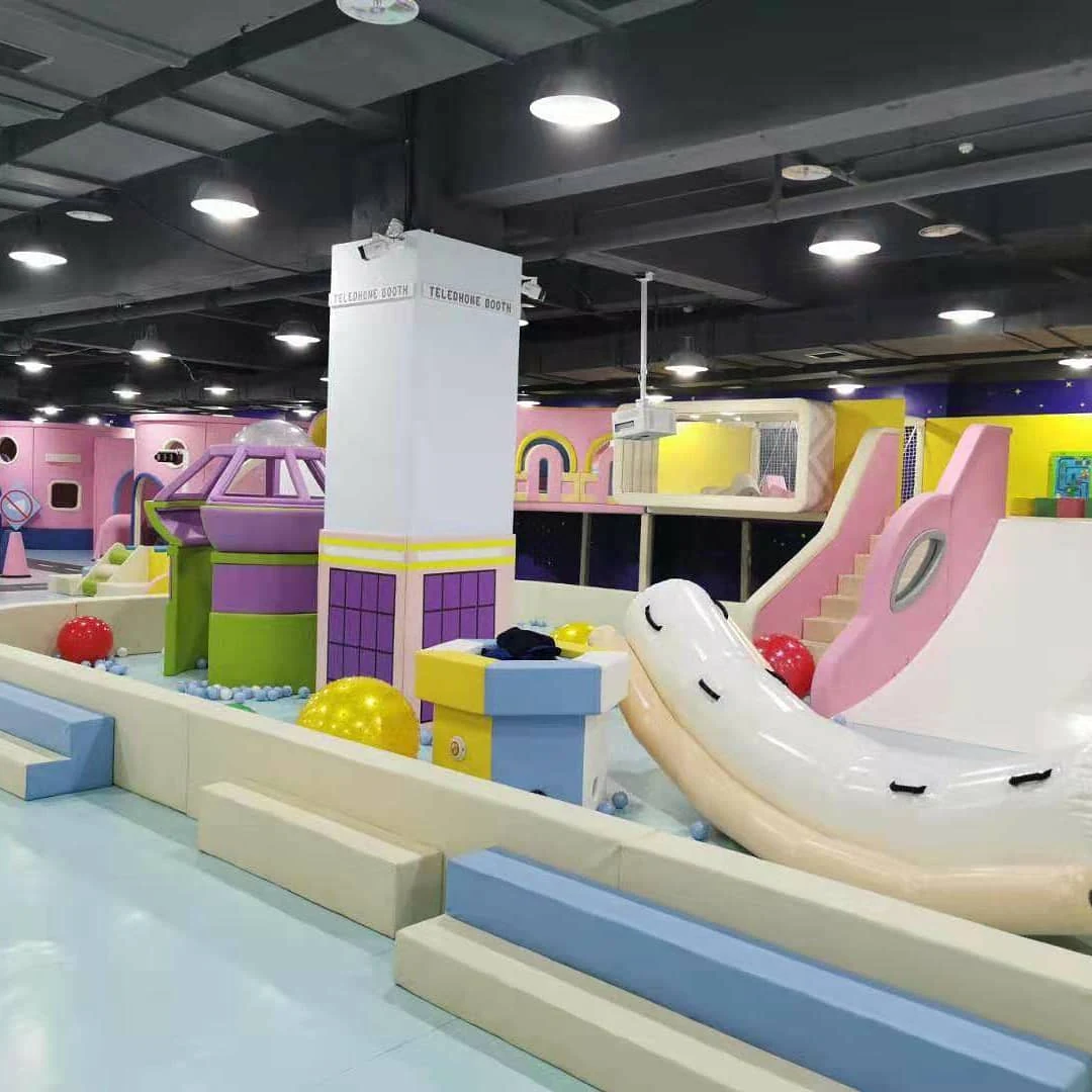 Commercial fiberglass and tube slide components in indoor playground