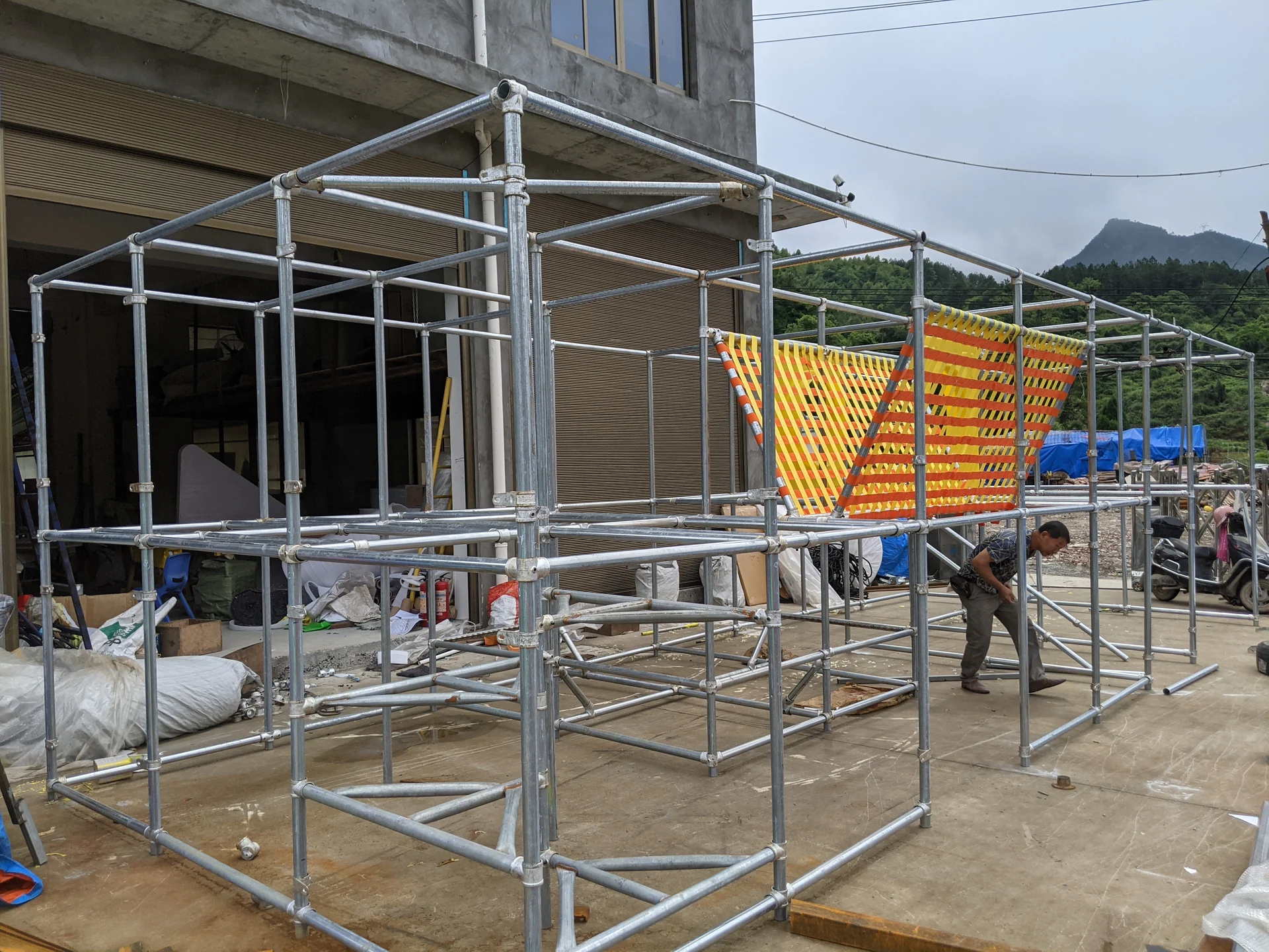 Playground frame and slide sections during on-site assembly